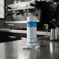 Urnex Rinza M90 on espresso machine counter