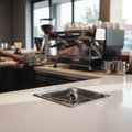 Rhino Pitcher Rinser Three-Quarter View in Cafe Setting